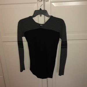 A grey and black hooded top